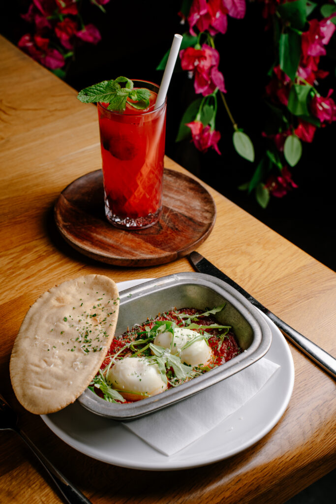 Chorizo baked eggs with tomato sauce and pita bread at Nesso Leeds brunch