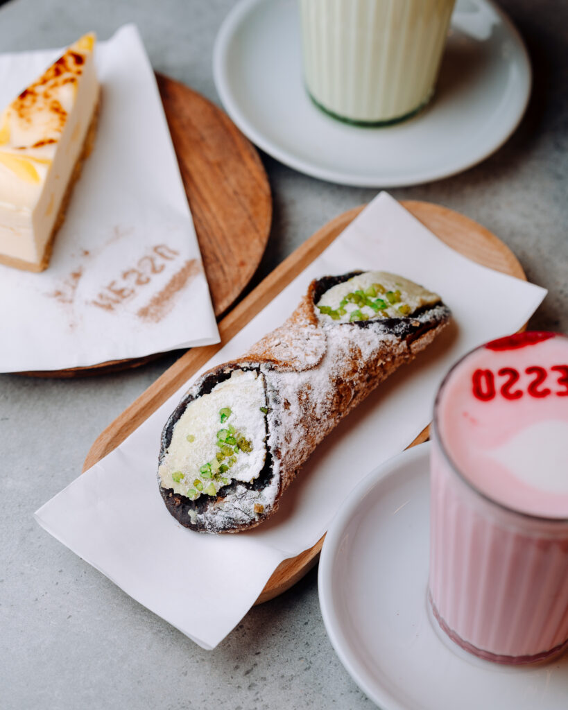 Best cannoli in Leeds at Nesso Coffee featuring a crispy Italian pastry shell, creamy ricotta filling, pistachio topping and icing sugar dusting