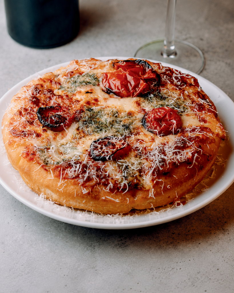 Focaccia Marinara at Nesso Coffee Leeds with baked tomato focaccia, garlic butter, roasted tomatoes and melted cheese